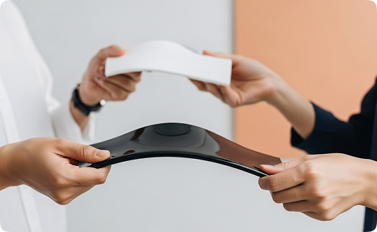 Engineers testing flexible material prototypes during product design process